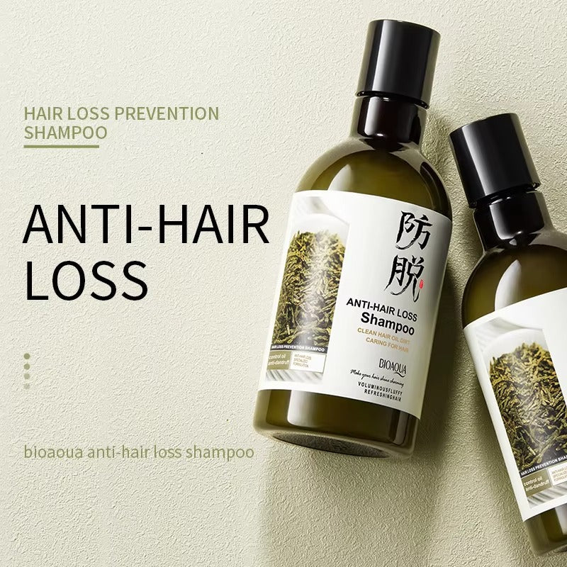 Anti-hair loss shampoo bottle with packaging on a beige background