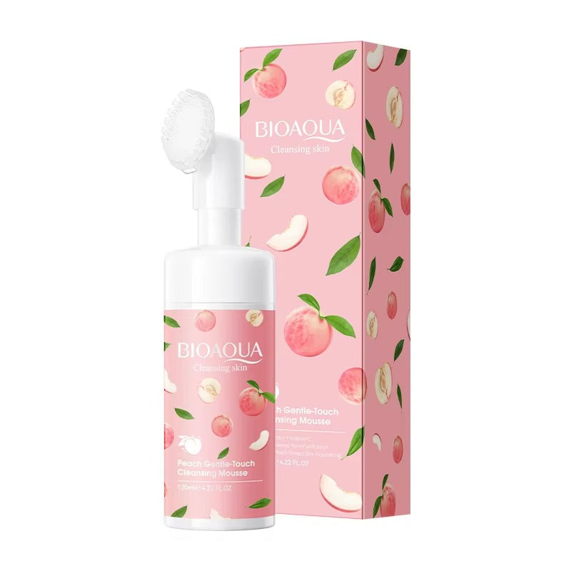 Bioaqua cleansing milk bottle and packaging with peach design on a white background