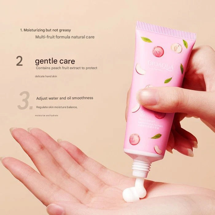 Hand holding a pink tube of hand cream with text on a beige background